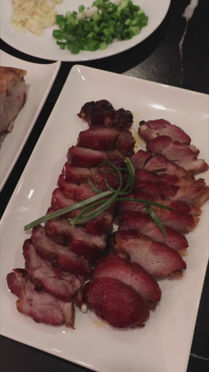 Plated roast meats and Kau Kong knives